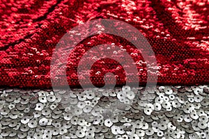 Shiny fabric on the border of red and silver