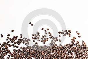 Shiny freshly roasted coffee beans on a white background. Isolated