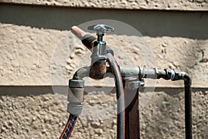 Shiny garden faucet and hose