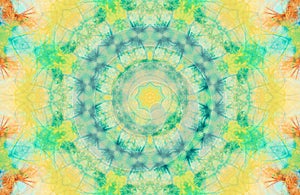 Shiny geometric kaleidoscope texture in  yellow and turquoise colors . Psychedelic eastern decor