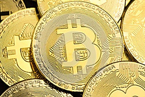 Shiny gold bitcoins as background,  Cryptocurrency and virtual money concept