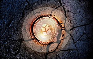 Shiny golden BANCOR cryptocurrency coin on dry earth dessert background mining photo