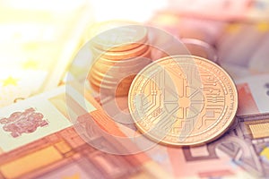 Shiny golden BITSHARES cryptocurrency coin on blurry background with euro money