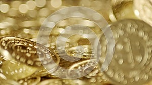 Shiny golden coins falling with sparkling golden dust. Symbolizing wealth, fortune, and prosperity