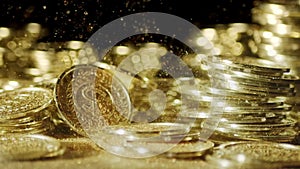 Shiny golden coins falling with sparkling golden dust. Symbolizing wealth, fortune, and prosperity