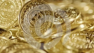 Shiny golden coins falling with sparkling golden dust. Symbolizing wealth, fortune, and prosperity