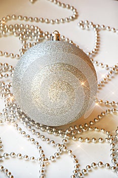 Gray Christmas ball on the Christmas tree. shiny ball. metallic color. decorations for the holiday. New year, Christmas. grey bead