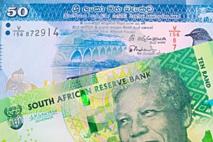 A shiny, green 10 rand bill from South Africa paired with a blue and white fifty rupee bank note from Sri Lanka.