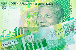 A shiny, green 10 rand bill from South Africa paired with a green and white twenty shekel bill from Israel.