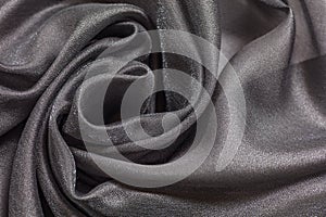 Shiny grey cloth background dark curly background