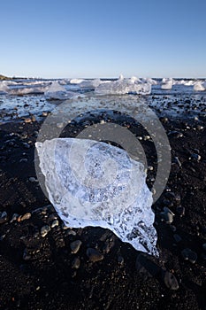 Shiny ice formation on the Diamond beach in the Jokulsarlon lagoon in Iceland