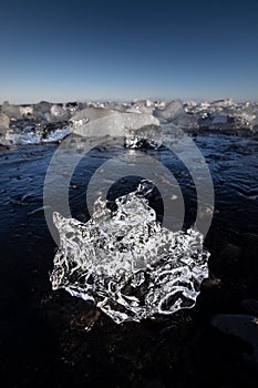 Shiny ice formation on the Diamond beach in the Jokulsarlon lagoon in Iceland
