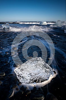 Shiny ice formation on the Diamond beach in the Jokulsarlon lagoon in Iceland