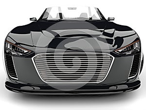 Shiny jet black modern cabriolet super car - front view extreme closeup shot