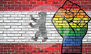 Shiny LGBT Protest Fist on a Berlin brick Wall Flag