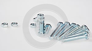 Shiny metal bolts and nuts of different sizes