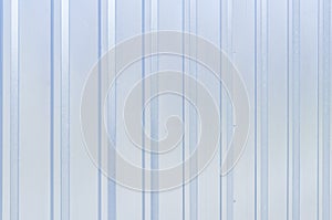 Shiny metal surface background with vertical lines