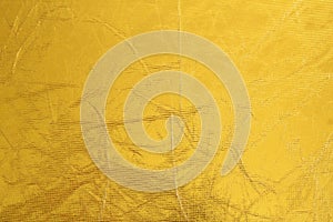 Shiny metal yellow texture background. Metallic pattern