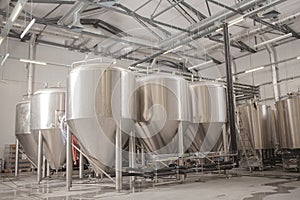 Shiny microbrewery beer tanks at beer factory