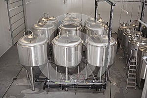Shiny microbrewery beer tanks at beer factory