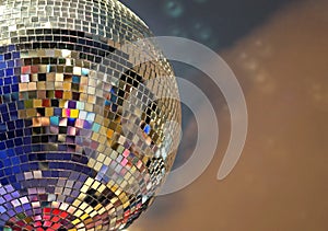 Shiny mirror ball with colorful highlights at the disco