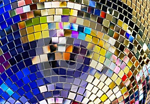Shiny mirror ball with colorful highlights at the disco