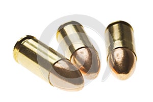 Shiny 9 mm caliber Bullets. Close-up of a 9mm full metal jacket ammo isolated on white background