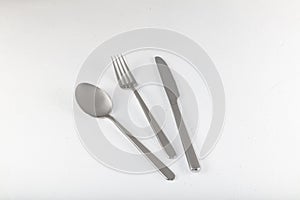 Shiny new cutlery, silverware close-up on white background