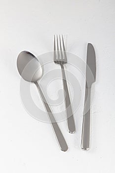 Shiny new cutlery, silverware close-up on white background