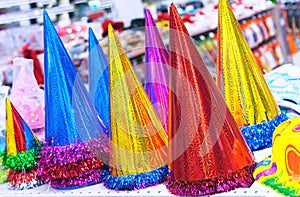 Shiny party hats with tinsel decoration for children`s parties