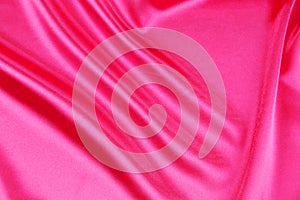 Shiny pink silk background.