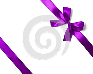 Shiny purple satin ribbon on white background