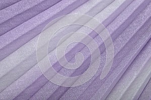 Shiny purple textile background,  violet pleated cloth as creative backdrop, lilac beautiful  bright material, colour of fabric,