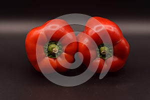 Shiny Red Bell Peppers on Black