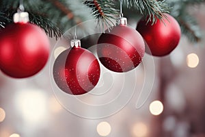 shiny red Christmas ball bouncing in front of blurred Christmas candle light and unfocused bokeh