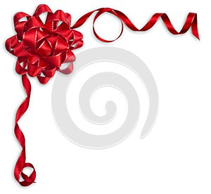 Shiny red satin ribbon and bow on white background