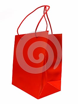 Shiny red shopping / gift bag isolated on white