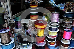 Shiny satin ribbons at traditional notions store