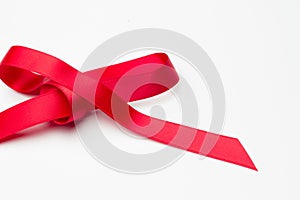 Red ribbon to make ties in Christmas gifts