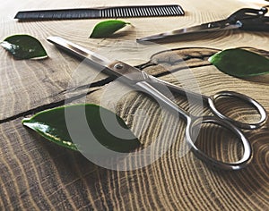 Shiny scissors on wooden background