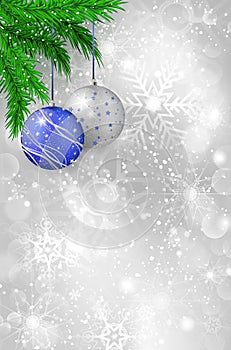 Shiny silver background with snowflakes, twigs and christmas balls