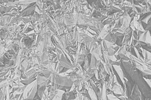 Shiny silver foil metal texture, abstract gray wrapping paper