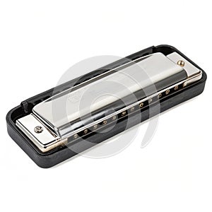Silver harmonica on black isolated on white background
