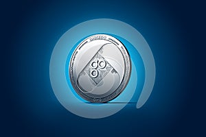 Shiny silver OMISEGO OMG coin displayed on gently lit dark blue background.