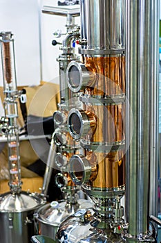 Shiny stainless steel and copper pipes. Apparatus for making vodka at home