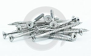 Shiny stainless steel wood screws on white background