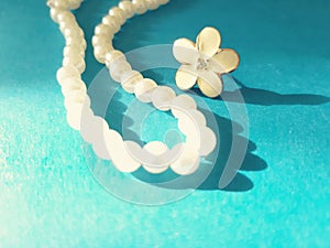 Shiny string of pearls and flower