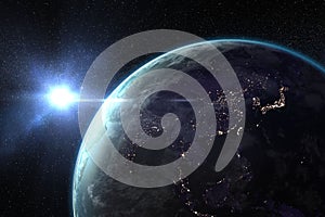 Shiny sun behind planet Earth