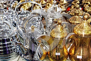 Shiny tea pots Arabian style coffee pods