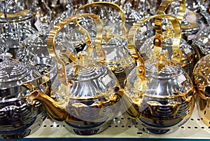 Shiny tea pots Arabian style coffee pods